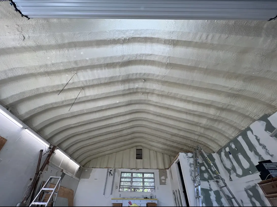 Spray polyurethane foam applied to the underside of a metal roof deck in Minneola